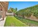 Lush green backyard with mature plants and trees, with a covered area for relaxing at 4525 N 66Th St # 85, Scottsdale, AZ 85251