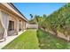 A backyard with a lush lawn and patio for relaxing, with mature plants and trees at 4525 N 66Th St # 85, Scottsdale, AZ 85251