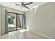 Bright bedroom with sliding glass doors opening to a private backyard patio at 4525 N 66Th St # 85, Scottsdale, AZ 85251