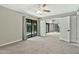 Spacious bedroom with carpet, ceiling fan, and sliding glass doors to the outdoors at 4525 N 66Th St # 85, Scottsdale, AZ 85251
