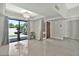 A beautiful chandelier highlights the dining area with tile floors and a view of a water feature at 4525 N 66Th St # 85, Scottsdale, AZ 85251