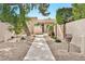 Charming front yard featuring desert landscaping and a sidewalk to the front door at 4525 N 66Th St # 85, Scottsdale, AZ 85251