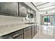 Updated kitchen features sleek black cabinets, subway tile backsplash, and stylish countertops at 4525 N 66Th St # 85, Scottsdale, AZ 85251