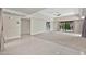 An expansive living room has both carpet and tile flooring, a ceiling fan, and sliding doors to the backyard at 4525 N 66Th St # 85, Scottsdale, AZ 85251