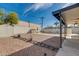The home features a vast backyard, a shed for storage, and a fenced pool at 542 E Flynn Ln, Phoenix, AZ 85012