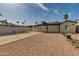 This backyard includes a fenced pool, shade structure, and rock landscaping for outdoor enjoyment at 542 E Flynn Ln, Phoenix, AZ 85012