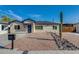 Charming single-story home with a xeriscaped front yard and a classic desert-inspired landscape at 542 E Flynn Ln, Phoenix, AZ 85012