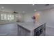 Open-concept kitchen featuring a center island, modern appliances, and seamless flow to living areas at 542 E Flynn Ln, Phoenix, AZ 85012