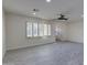 Bright living space with a large window and wood-look flooring, creating a welcoming atmosphere at 542 E Flynn Ln, Phoenix, AZ 85012