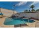 Enjoy a refreshing dip in this fenced backyard pool, perfect for relaxation and fun at 542 E Flynn Ln, Phoenix, AZ 85012