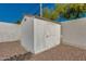 View of the backyard shed, offering extra storage space, with rock landscaping at 542 E Flynn Ln, Phoenix, AZ 85012