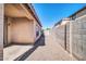 Exterior view of the backyard with a patio area and a gravel side yard at 6330 W Constance Way, Laveen, AZ 85339