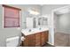 Bathroom featuring a double vanity and window at 6330 W Constance Way, Laveen, AZ 85339