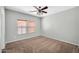 Bedroom with window and ceiling fan at 6330 W Constance Way, Laveen, AZ 85339