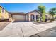 Inviting single-story home with a well-maintained front yard and tile roof at 6330 W Constance Way, Laveen, AZ 85339