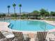 Relaxing community pool with lounge chairs, mountain views, and a gazebo at 6330 W Constance Way, Laveen, AZ 85339