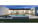 Gorgeous backyard featuring a pool, spa, lounge chairs and modern landscaping at 7001 E Joan De Arc Ave, Scottsdale, AZ 85254