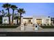 Contemporary home with a walkway and palm trees lining the facade at 7001 E Joan De Arc Ave, Scottsdale, AZ 85254