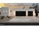 Modern home exterior with sleek garage doors and stylish lighting at 7001 E Joan De Arc Ave, Scottsdale, AZ 85254