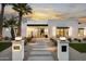 Inviting modern home with desert landscaping, front yard, and well-lit pathway leading to the entrance at 7001 E Joan De Arc Ave, Scottsdale, AZ 85254