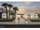 Stunning exterior showcasing a modern home design, palm trees, and manicured desert landscaping at 7001 E Joan De Arc Ave, Scottsdale, AZ 85254