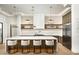 Modern kitchen features a large island, white countertops, pendant lighting, and sleek appliances at 7001 E Joan De Arc Ave, Scottsdale, AZ 85254