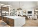 Open concept kitchen, flowing into a well-lit living area, boasts modern appliances and lots of counter space at 7001 E Joan De Arc Ave, Scottsdale, AZ 85254