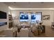 Bright and inviting living room with modern decor, fireplace, and seamless indoor-outdoor flow at 7001 E Joan De Arc Ave, Scottsdale, AZ 85254