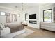 Spacious main bedroom boasts a modern fireplace, sleek TV, and elegant decor for a luxurious retreat at 7001 E Joan De Arc Ave, Scottsdale, AZ 85254