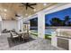 Expansive covered patio boasting a full outdoor kitchen, dining area, and cozy seating with outdoor view at 7001 E Joan De Arc Ave, Scottsdale, AZ 85254