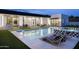 Backyard oasis featuring a sparkling pool, lounge chairs, manicured lawn, and covered outdoor area at 7001 E Joan De Arc Ave, Scottsdale, AZ 85254