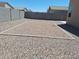 Low maintenance gravel backyard with defined area perfect for outdoor entertaining in this desert landscape at 7218 E Grouse Ct, San Tan Valley, AZ 85143