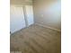 Bedroom with neutral carpeting featuring two closets, offering storage and space at 7218 E Grouse Ct, San Tan Valley, AZ 85143