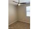 Bedroom with neutral carpeting featuring a ceiling fan and a window with blinds, offering comfortable space at 7218 E Grouse Ct, San Tan Valley, AZ 85143