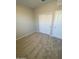 Bedroom with neutral carpeting featuring a closet with sliding doors, offering storage and space at 7218 E Grouse Ct, San Tan Valley, AZ 85143