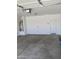Clean garage featuring a water heater and white walls at 7218 E Grouse Ct, San Tan Valley, AZ 85143
