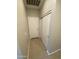 Hallway featuring tile flooring and a closet with sliding doors at 7218 E Grouse Ct, San Tan Valley, AZ 85143