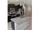 Bright kitchen with stainless steel appliances, granite countertops, and tile backsplash at 7218 E Grouse Ct, San Tan Valley, AZ 85143