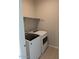 Convenient laundry room featuring a modern washer and dryer, and built in shelves at 7218 E Grouse Ct, San Tan Valley, AZ 85143