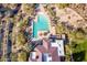 Stunning aerial view of community pool with lounge chairs, lush landscaping, and convenient parking at 7438 E Visao Dr, Scottsdale, AZ 85266
