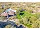 Aerial view showcases the community amenities with pool, green spaces, and parking areas at 7438 E Visao Dr, Scottsdale, AZ 85266