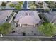 This desert home has great curb appeal with mature trees and lush desert landscaping at 7438 E Visao Dr, Scottsdale, AZ 85266