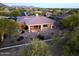 This lovely desert home features an inviting covered patio perfect for enjoying mountain views from the backyard at 7438 E Visao Dr, Scottsdale, AZ 85266