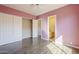 Bedroom with wood-look tile flooring has a view into the adjoining bathroom at 7438 E Visao Dr, Scottsdale, AZ 85266