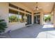 Outdoor covered patio with ceiling fan and desert landscape views at 7438 E Visao Dr, Scottsdale, AZ 85266