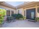 Relaxing front courtyard with a cozy seating area and mature landscaping at 7438 E Visao Dr, Scottsdale, AZ 85266