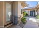 Charming walkway leading to the entrance, accented by stone details and desert greenery at 7438 E Visao Dr, Scottsdale, AZ 85266