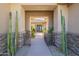 Inviting front entrance showcasing desert landscaping and a grand entryway leading into the home at 7438 E Visao Dr, Scottsdale, AZ 85266