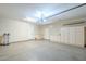 Bright, organized garage with built-in storage cabinets and ample space at 7438 E Visao Dr, Scottsdale, AZ 85266
