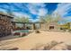 Relaxing community hot tub with stone accents, lounge area, and desert landscaping at 7438 E Visao Dr, Scottsdale, AZ 85266
